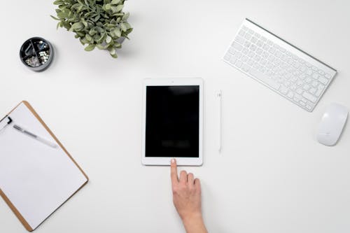 Free White Ipad on White Table Stock Photo