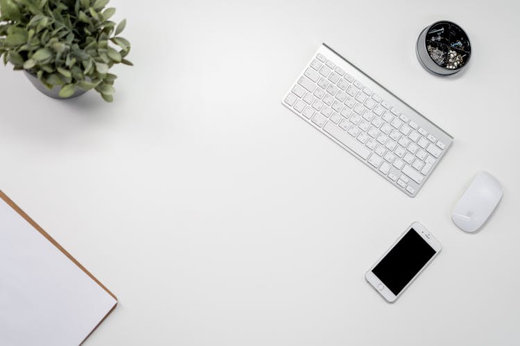 White Apple Keyboard Beside White Ipad