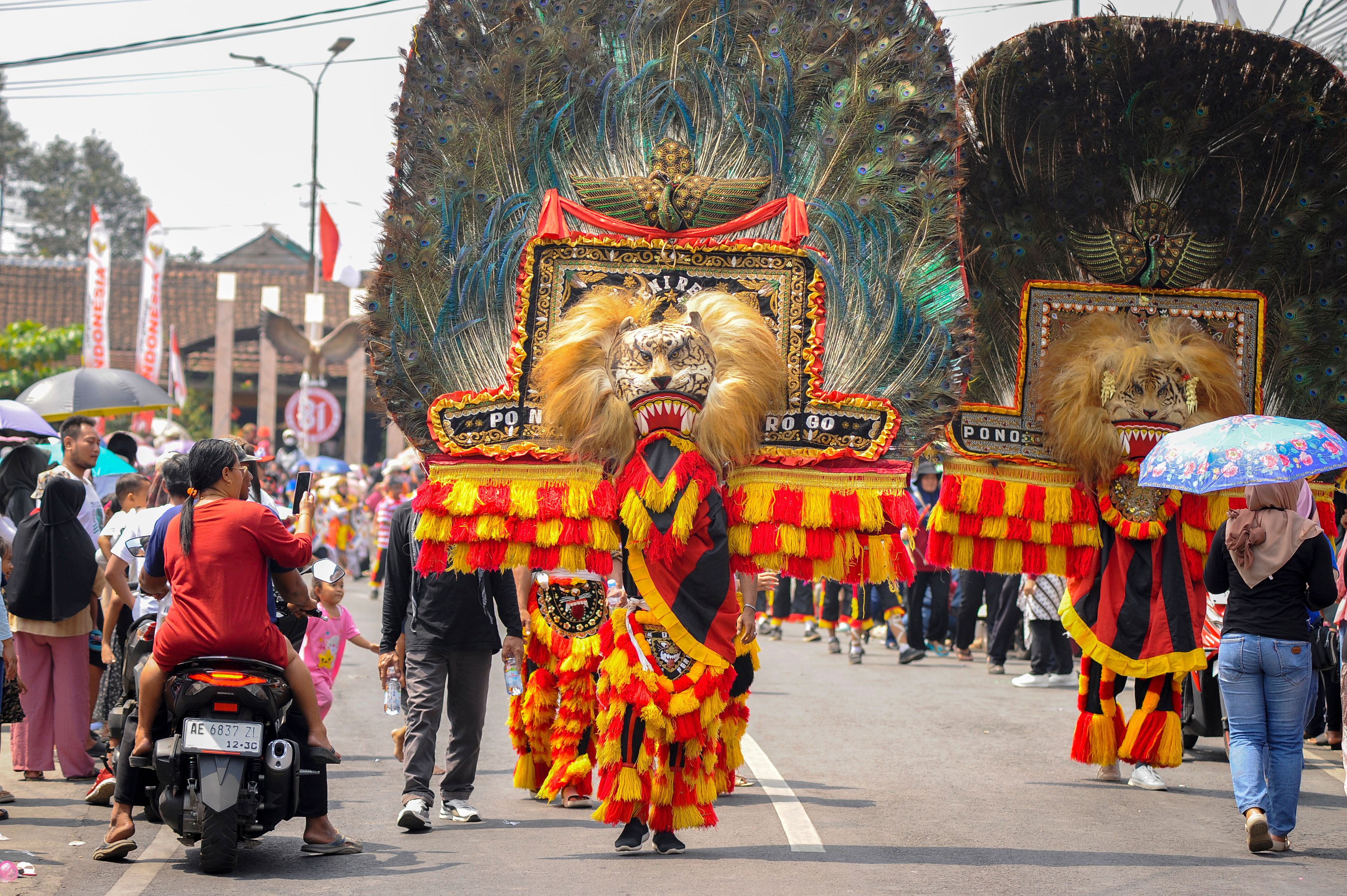 Lively street parade featuring the vibrant and traditional Reog Ponorogo dance in Indonesia.