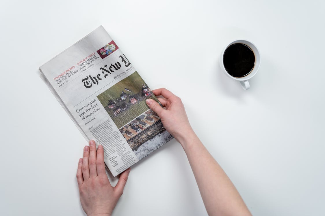 Free Person Holding A Newspaper Stock Photo