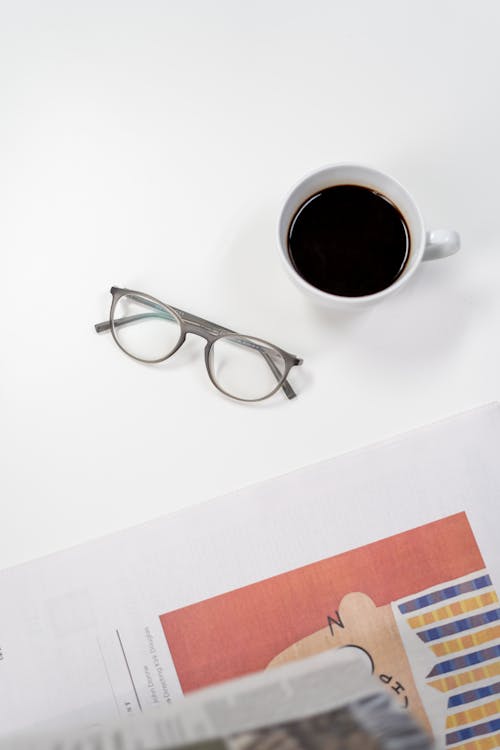 Free Black Framed Eyeglasses on White Table Stock Photo