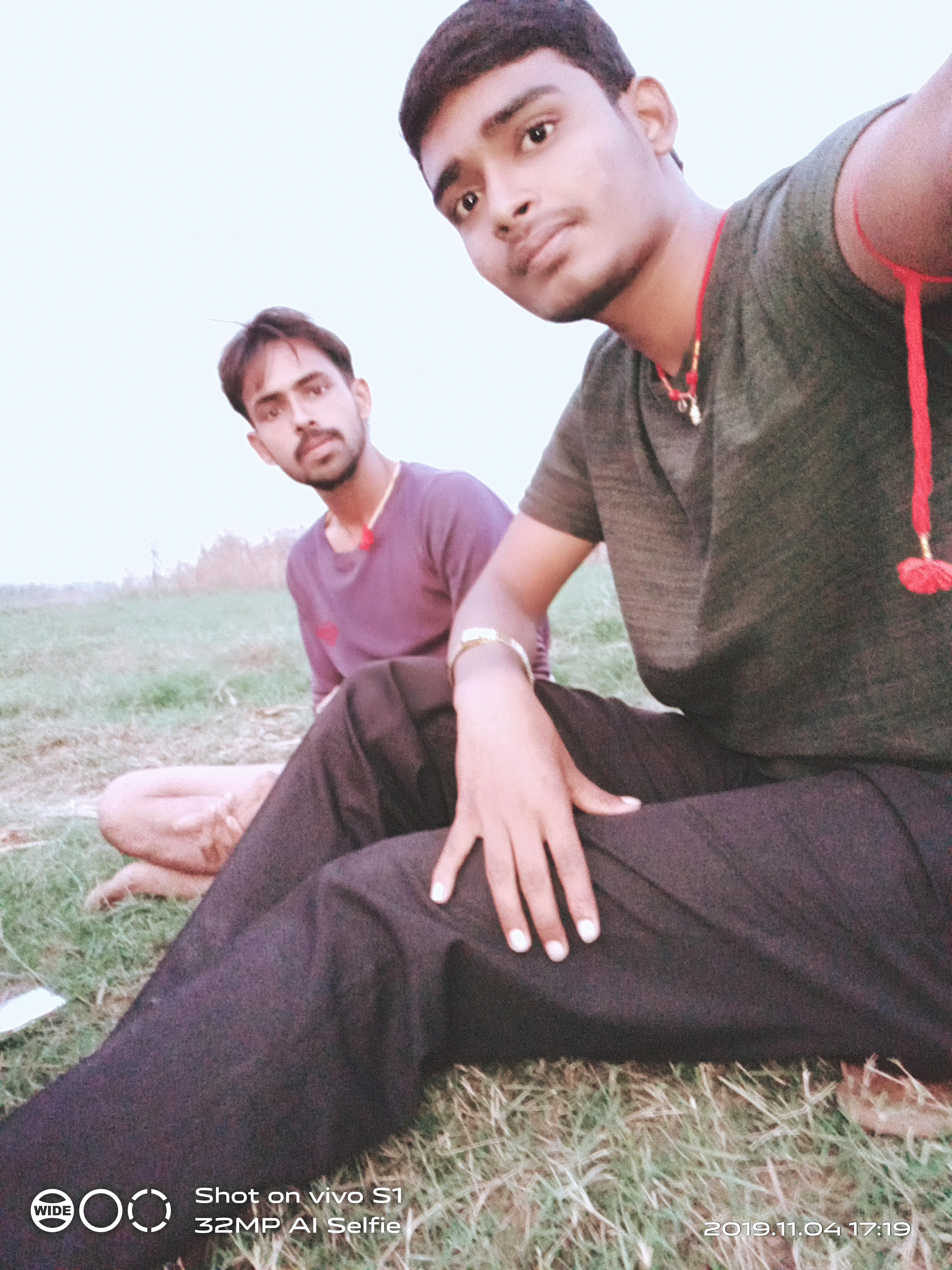 A journalist working at a desk with a laptop and notepad