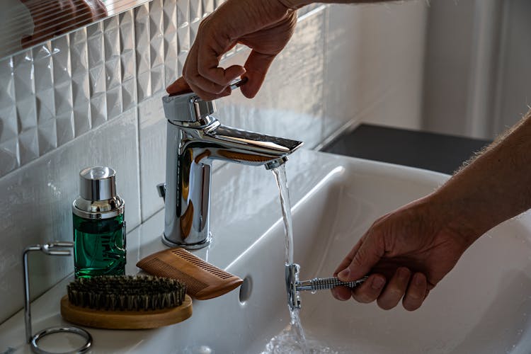 Person Washing Shaver