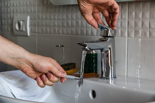 Free Person Washing Shaver On Sink Stock Photo