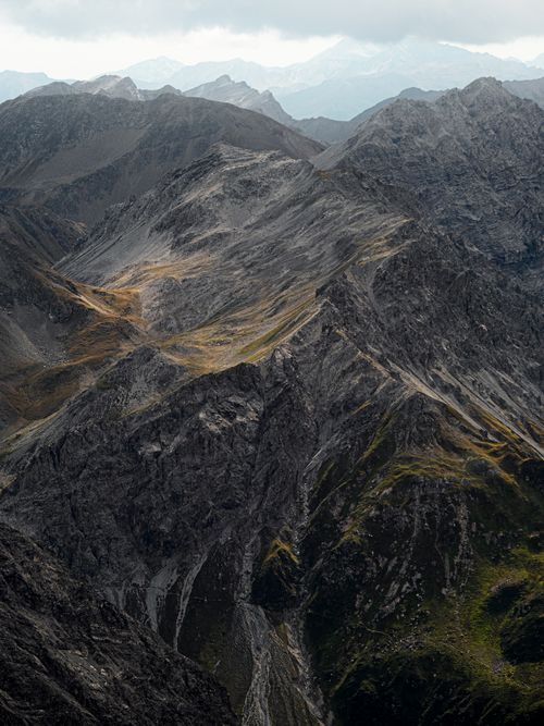 Free Breathtaking view of rugged alpine peaks in Davos, Switzerland, with dramatic light and shadow contrast. Stock Photo