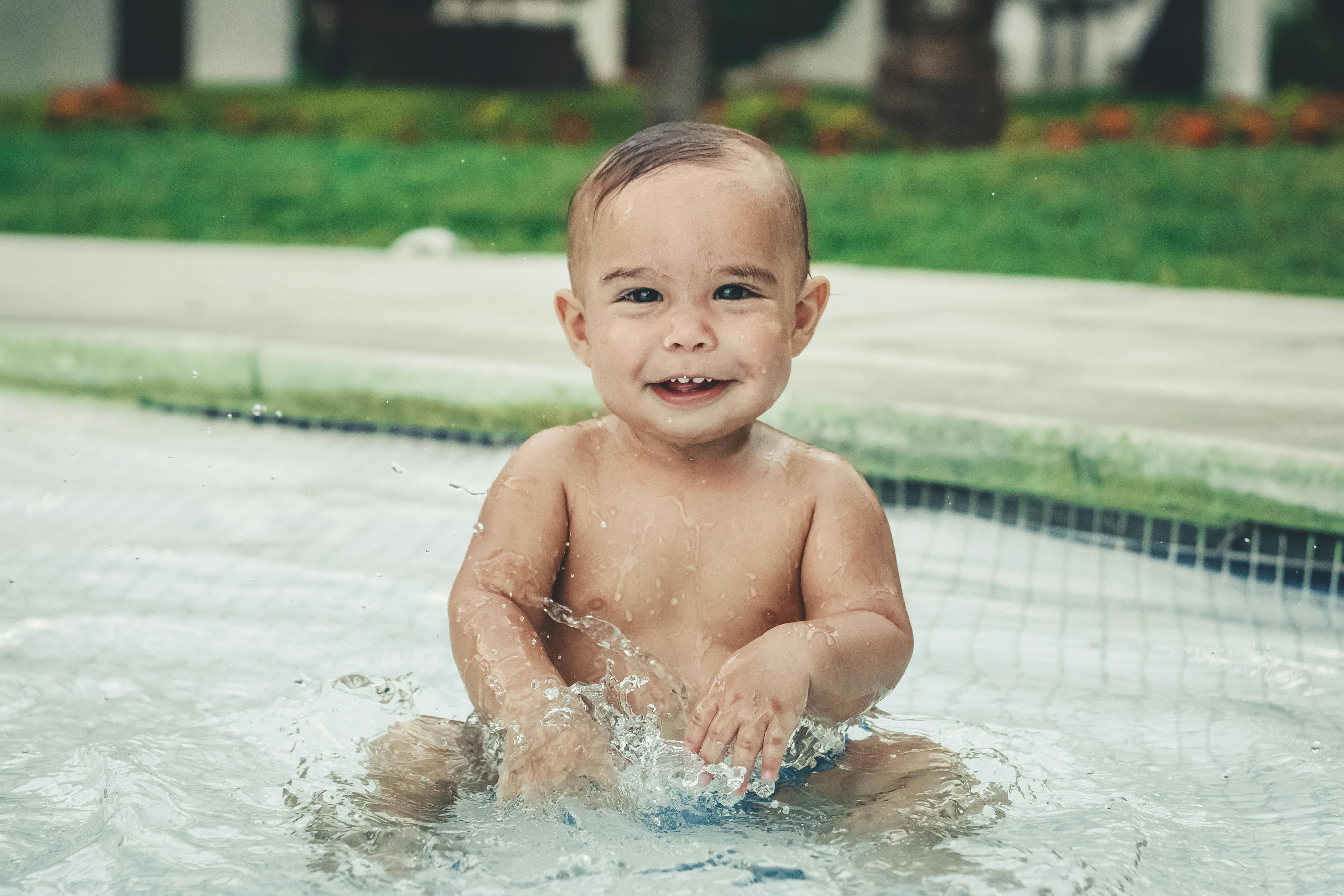 Topless Baby In The Swimming Pool