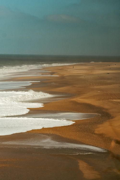 Free Stunning view of the sweeping coastline at Nazaré, known for its incredible waves. Stock Photo