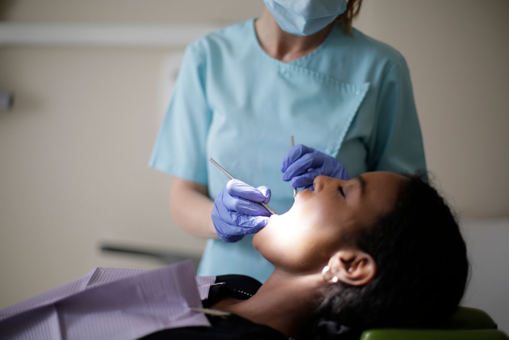 Dentist providing gentle care during a check-up