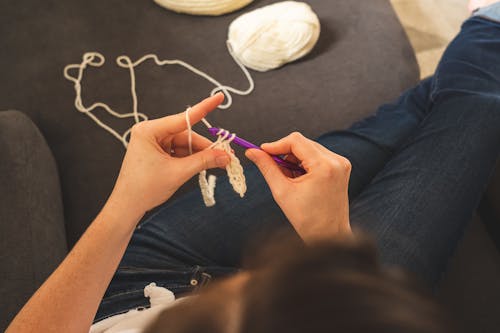 Person Holding A Crochet Hook