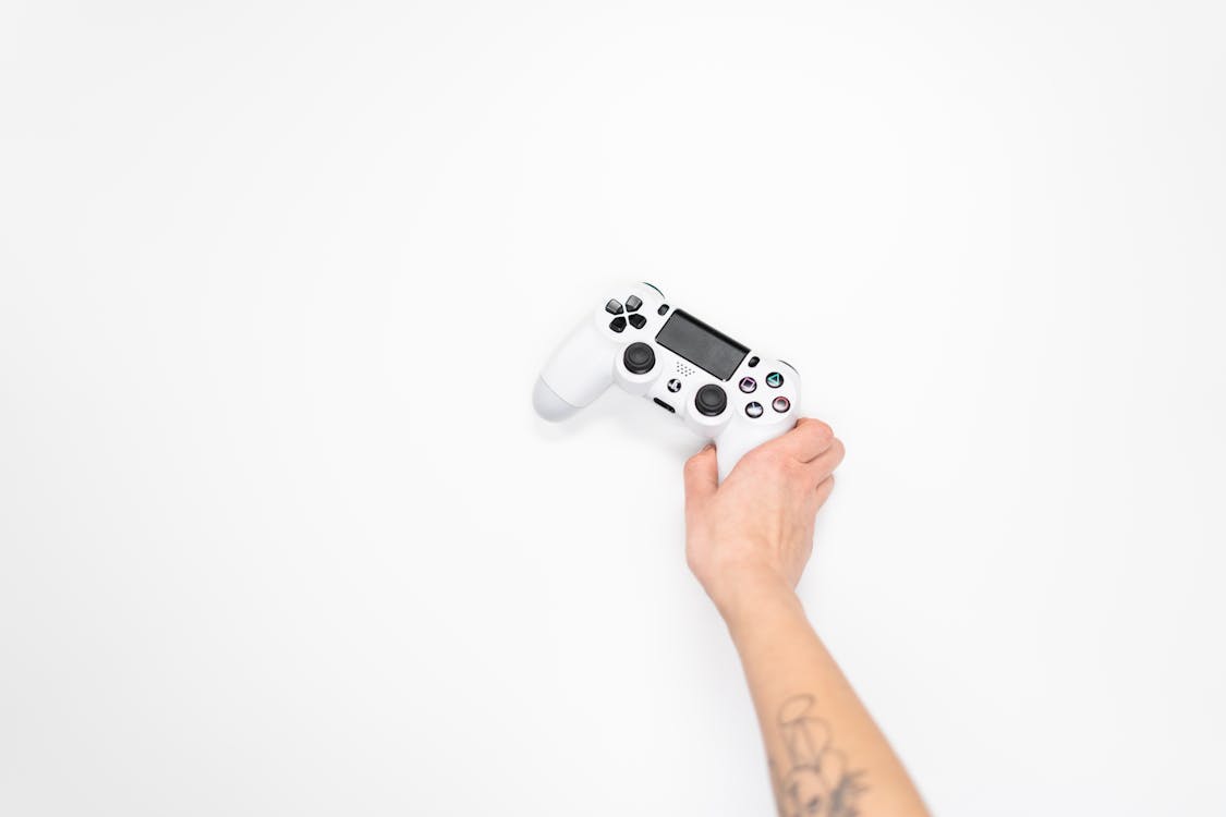 Person Holding White Sony Ps 4 Controller