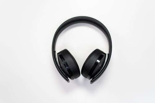 Free Black Wireless Headphones on White Surface Stock Photo