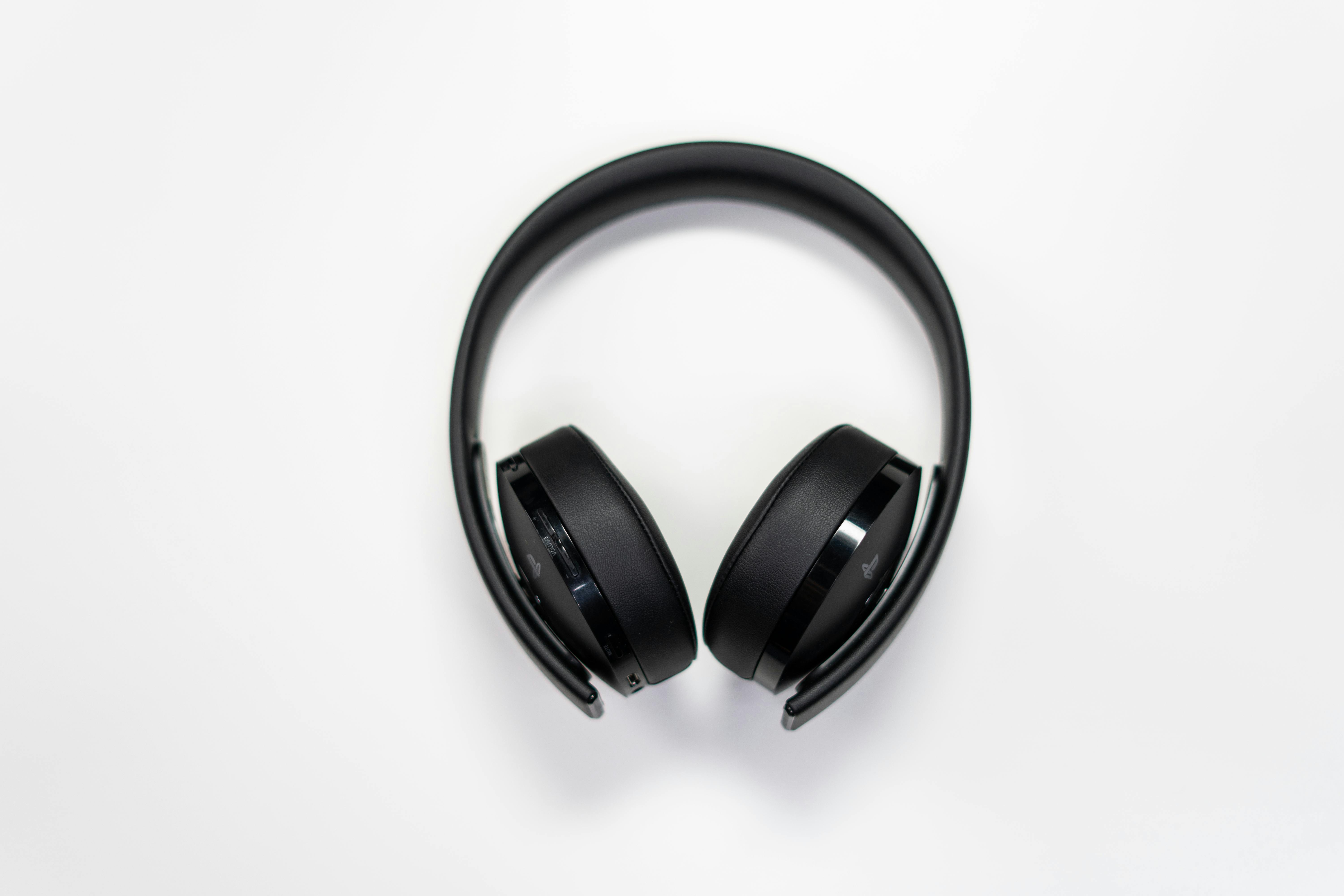 Black Wireless Headphones On White Surface Free Stock Photo Black Wireless Headphones On White Surface Free Stock Photo