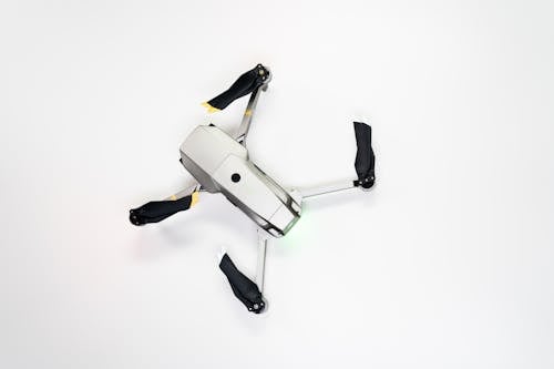 Free White and Black Drone on White Surface Stock Photo