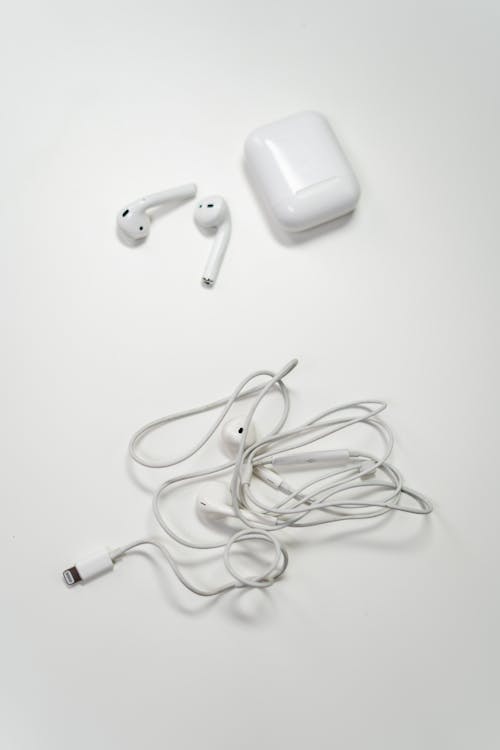 Free White Earbuds on White Surface Stock Photo