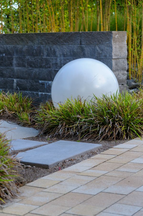 Stone garden pathway framed by planting in a UAE landscape