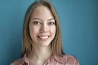Smiling young woman looking at camera