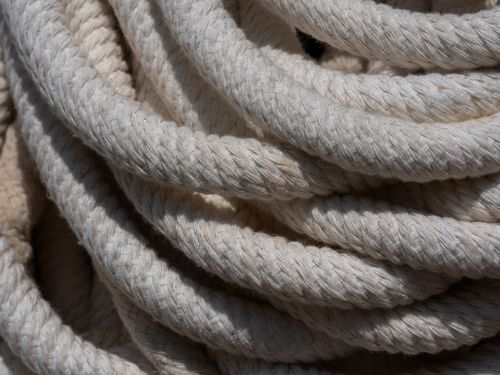 Free Detailed close-up of coiled nautical rope showcasing texture and rustic appeal. Stock Photo