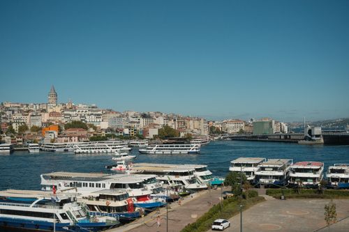 Free A vibrant cityscape of Istanbul featuring the Galata Tower and busy waterfront on a sunny day. Stock Photo