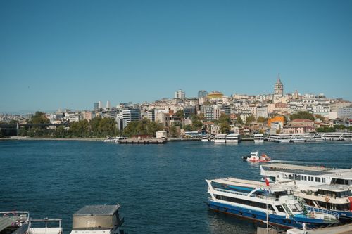 Free Beautiful daytime view of Istanbul's skyline featuring the iconic Galata Tower by the waterfront. Stock Photo