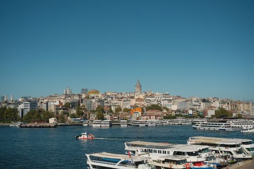 Free Panoramic view of Istanbul's skyline with the iconic Galata Tower and vibrant waterfront. Stock Photo