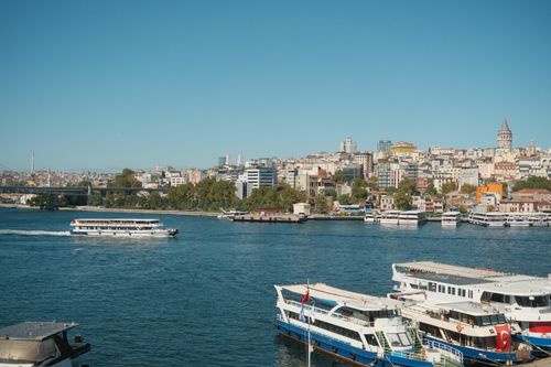 Free A beautiful view of Istanbul featuring ferries on the Bosphorus and the iconic Galata Tower. Stock Photo