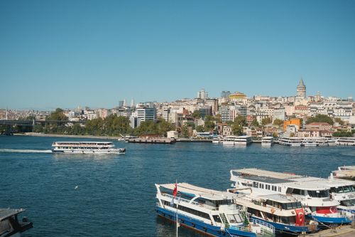 Free Scenic view of Istanbul's skyline with the iconic Galata Tower and bustling Bosphorus waters. Stock Photo