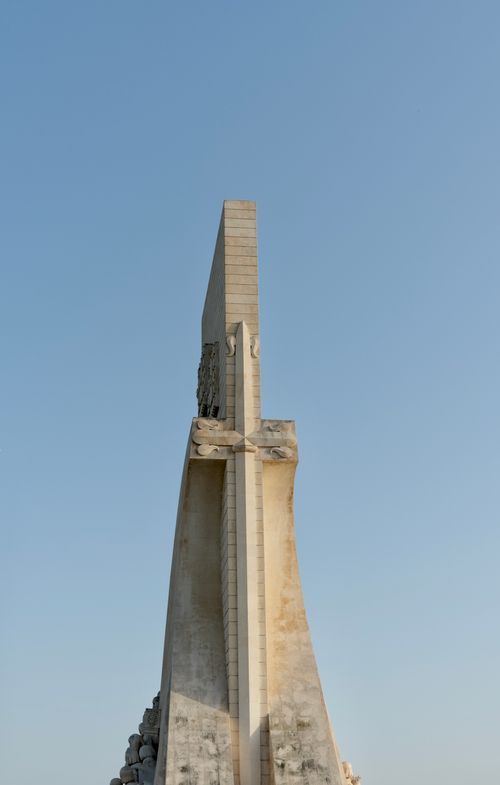 Free Side view of a tall monument under a clear blue sky, capturing its unique architecture. Stock Photo