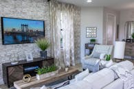 Black Flat Screen Tv Turned On