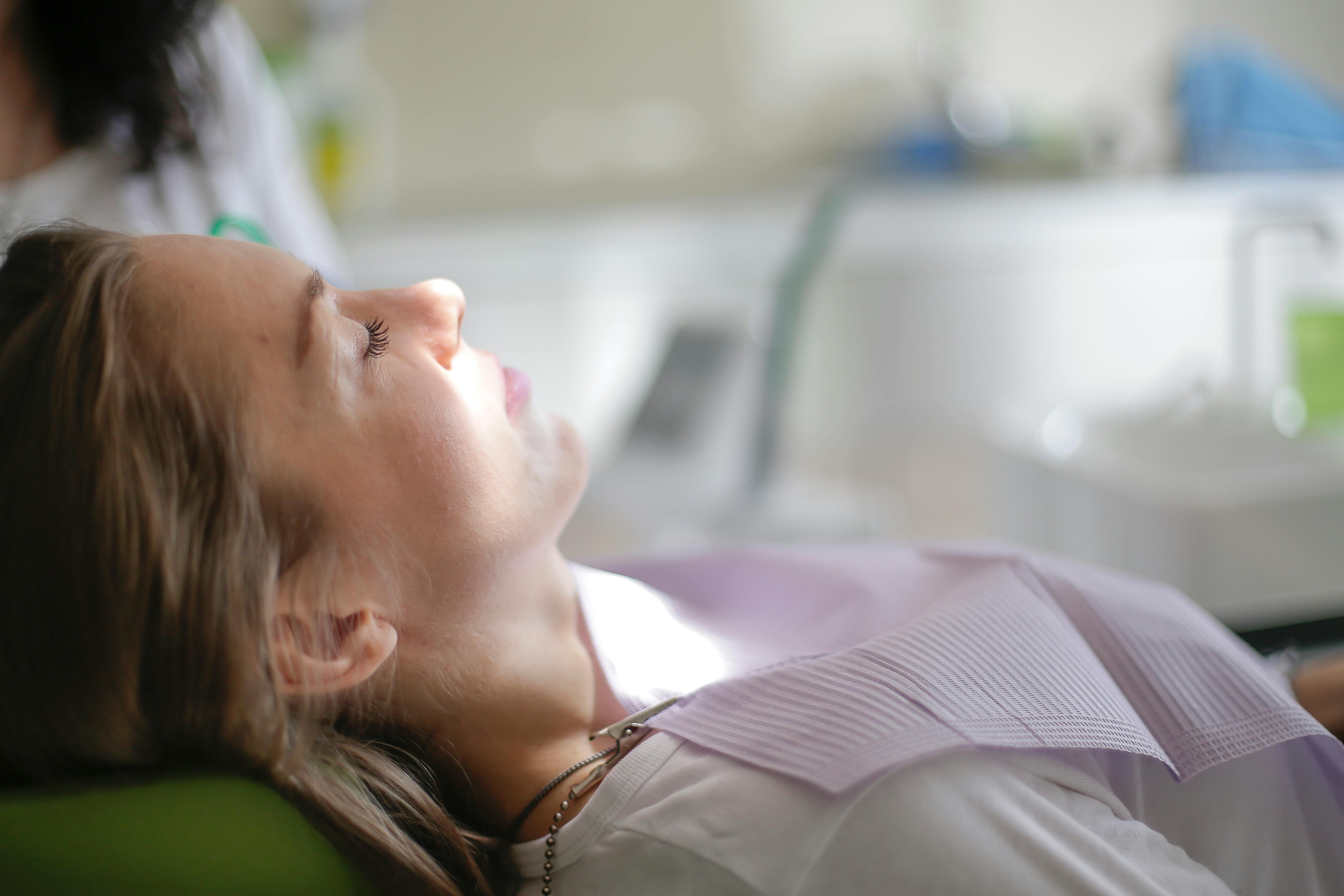 patient lying on dental chair in clinic