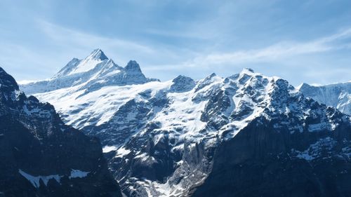 Free Majestic snow-covered mountains under a clear blue sky in the Swiss Alps. Stock Photo