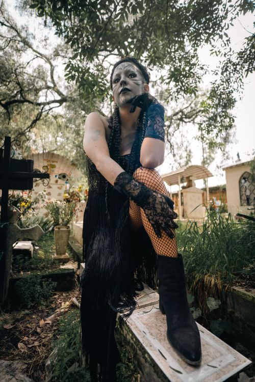 Free A person in elaborate gothic makeup and costume posing in a cemetery in Mexico City. Stock Photo