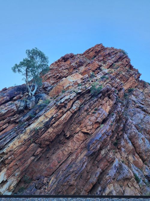 Free Dramatic red rock formations with unique strata in the Australian outback landscape. Stock Photo