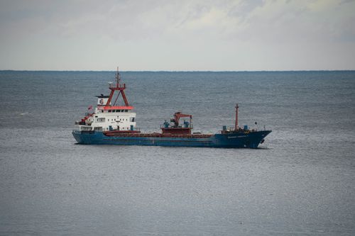 Free A cargo ship sails on the calm waters of the Black Sea near Rize, Türkiye, under a cloudy sky. Stock Photo