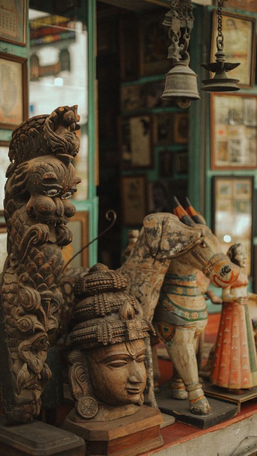 Free Intricately carved wooden sculptures displayed at a market in Udaipur, India, showcasing traditional craftsmanship. Stock Photo