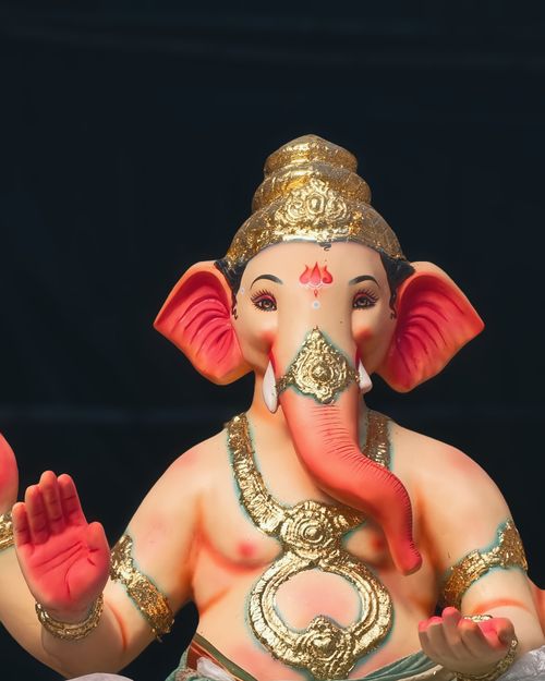 Free Close-up of a colorful Ganesh idol with intricate gold detailing in Mumbai, India. Stock Photo
