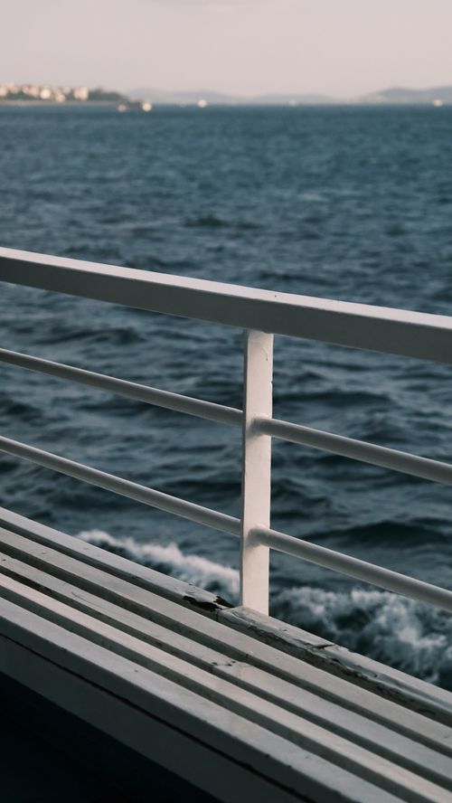 Free Serene ocean view captured from a boat's railings, depicting a peaceful maritime scene. Stock Photo
