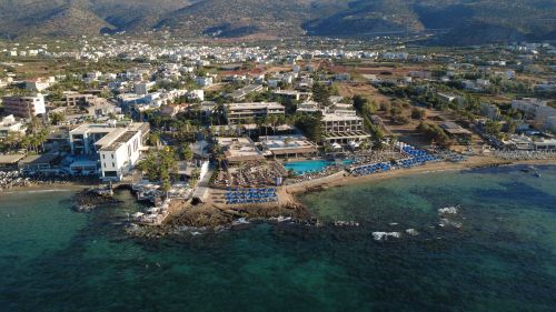 Free Aerial shot of Malia, Greece highlighting coastal resorts and scenic seaside views. Stock Photo