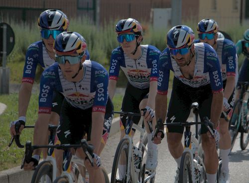 Free Professional cyclists in a group race during the day, showcasing teamwork. Stock Photo