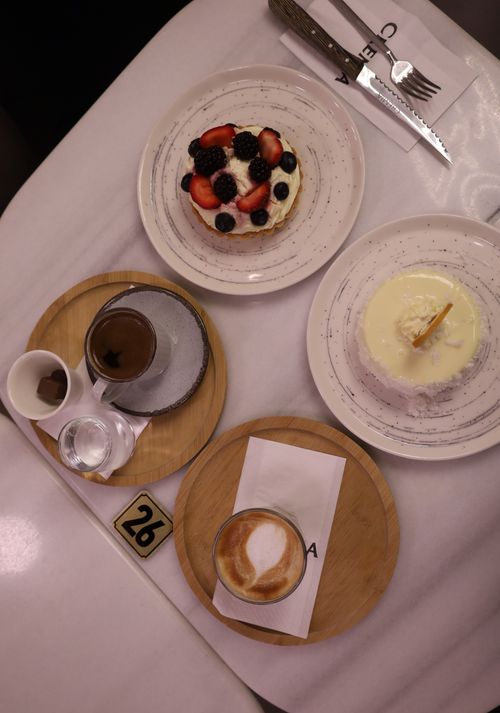 Free Top view of desserts and coffee on a cafe table, perfect for food lovers. Stock Photo