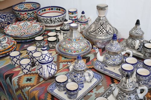 Free A vibrant array of Moroccan ceramics and teapots with intricate designs. Stock Photo