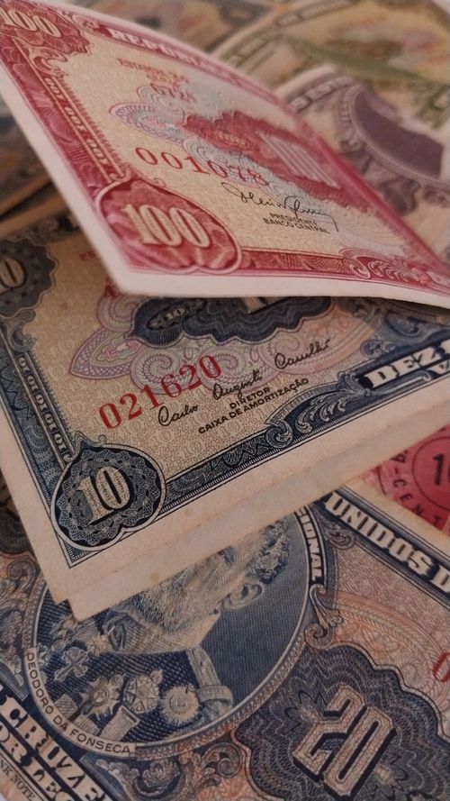 Free Close-up of colorful vintage banknotes showcasing detailed designs and historical currencies. Stock Photo