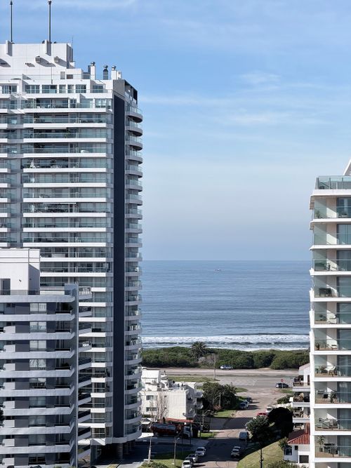 Free View of modern high-rise buildings with ocean backdrop in Punta del Este, Uruguay. Stock Photo