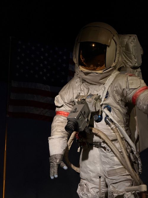 Free Astronaut in full space suit with an American flag in the background. Stock Photo