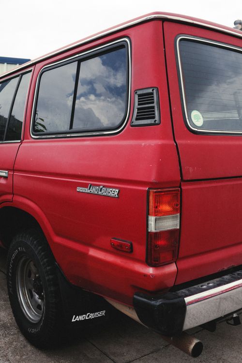 Free A vintage red SUV parked outdoors, showcasing its retro design in Houston, Texas. Stock Photo