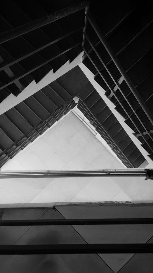Free Artistic black and white photo capturing a geometric staircase design from above. Stock Photo