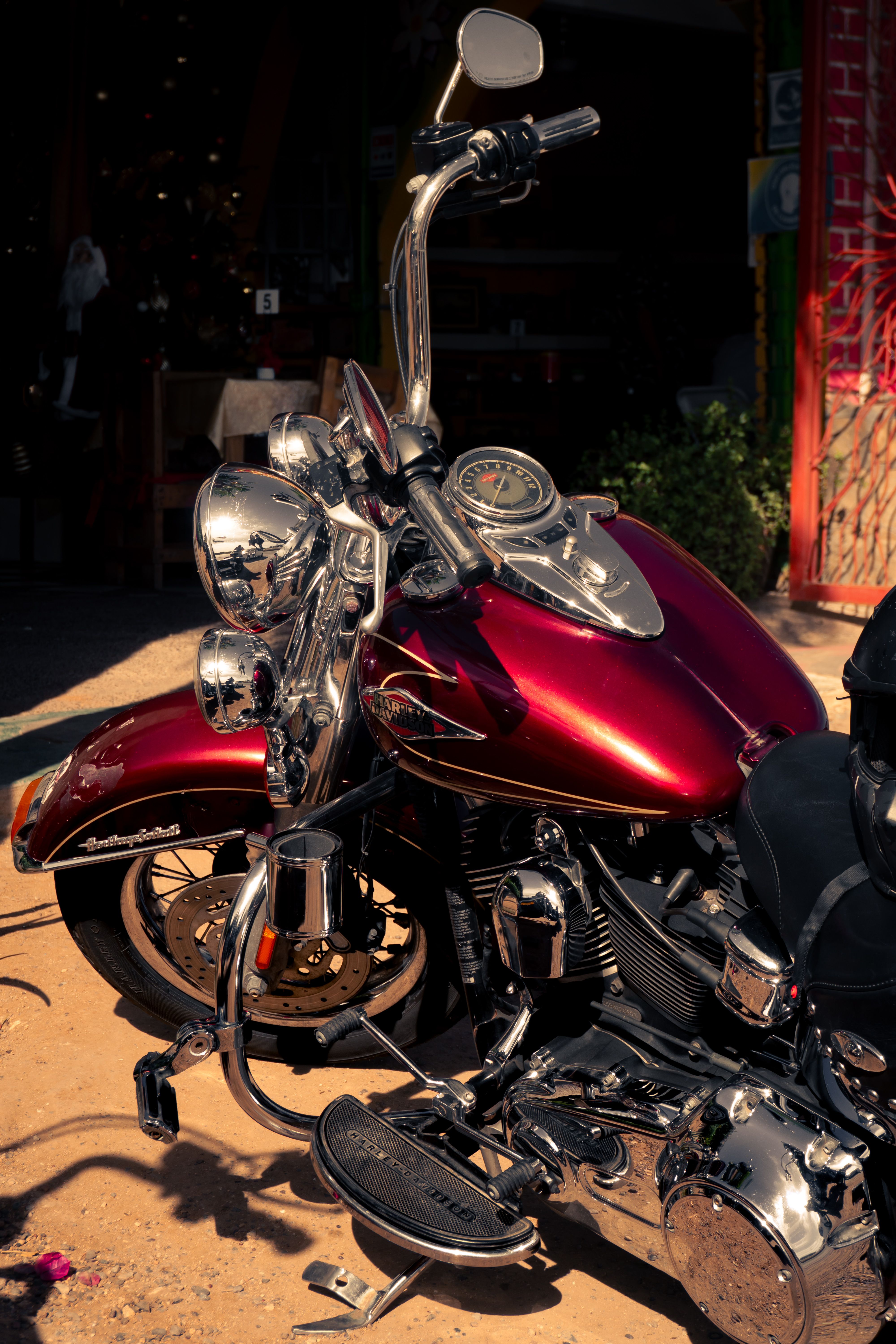 A shiny red motorcycle parked outdoors in La Paz, Baja California Sur, capturing the essence of motorcycling.
