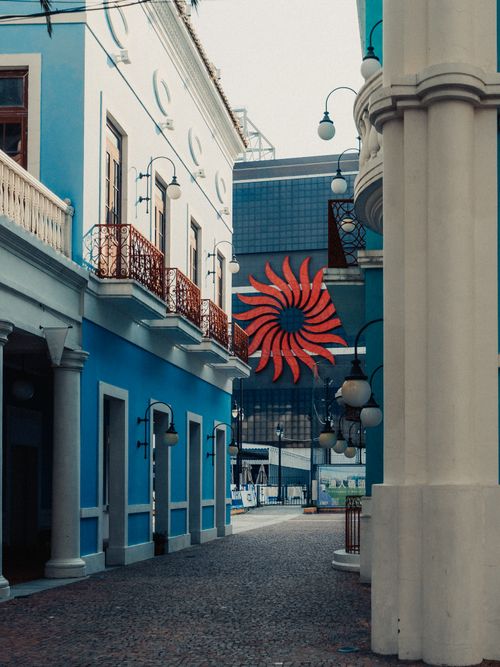 Free Quaint alley in Macao with colorful colonial architecture and decorative details. Stock Photo