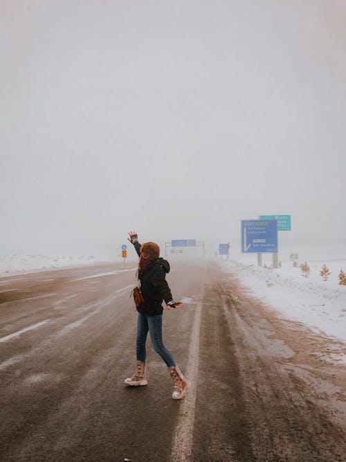 Woman Standing On Side Of The Road