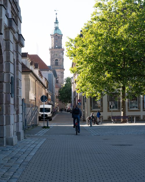 Free Explore a picturesque Bavarian street lined with historic architecture and cobblestones, perfect for travel photography. Stock Photo