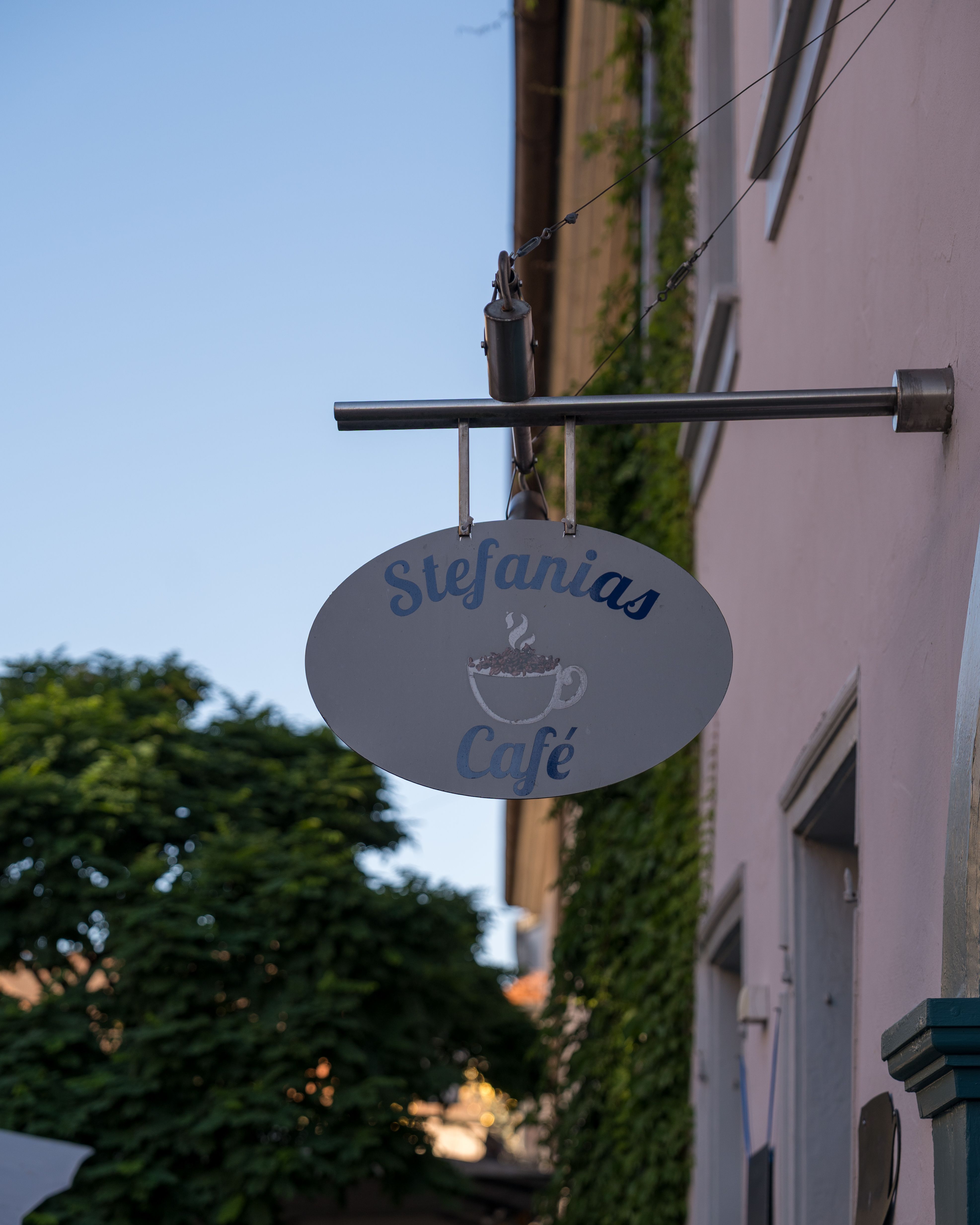 Discover the quaint charm of Stefanias Café nestled in a historic Bavarian street.